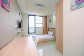 Nice 2BR at 26th Floor Evenciio Margonda Apartment By Travelio